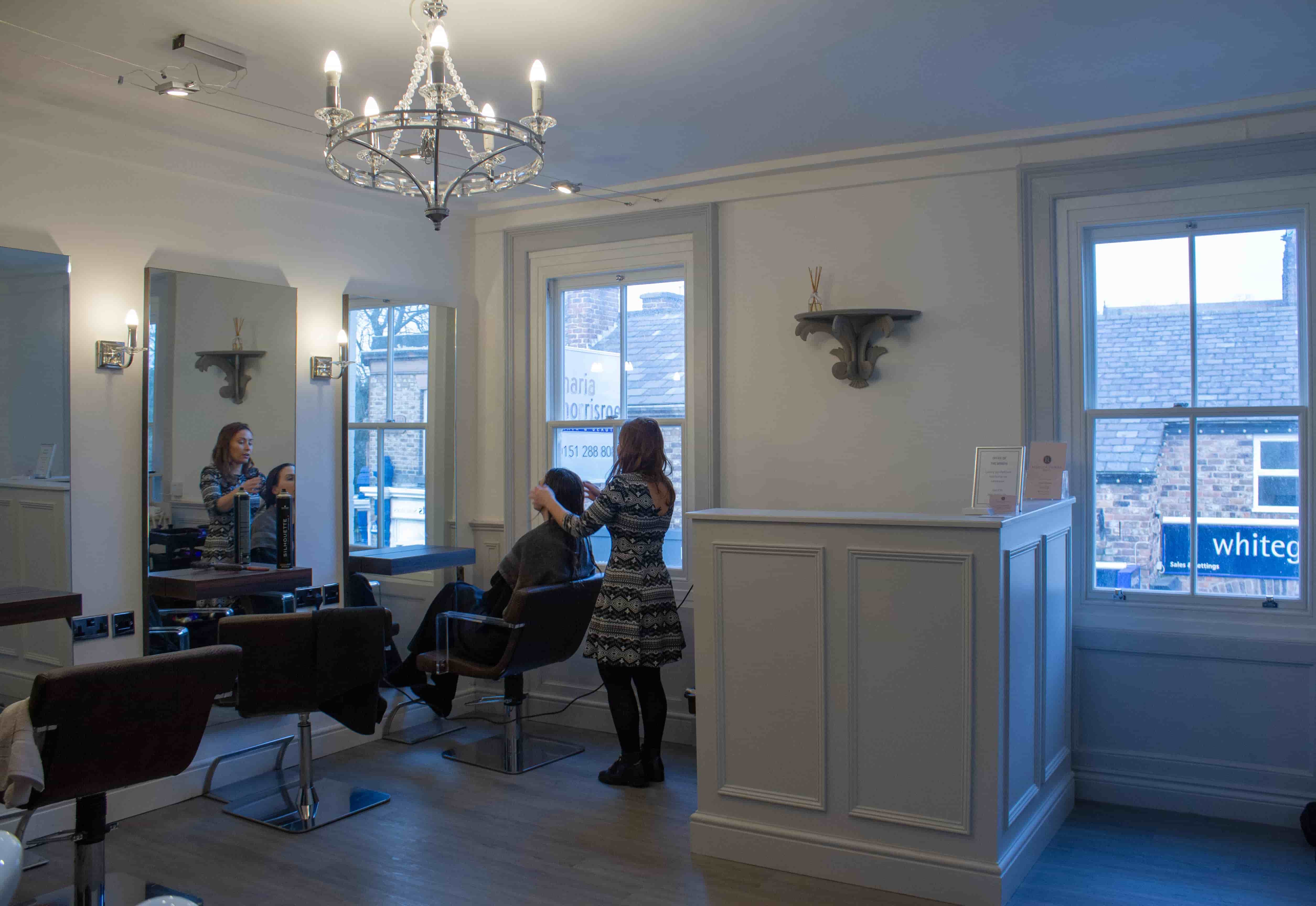 Stylist working with a client inside Maria Morrisroe Hair & Beauty, Woolton Village
